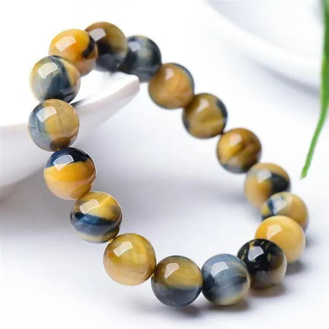 Handmade fantasy tiger eye agate unisex bracelet with round beads in 8mm, 10mm or 12mm sizes.