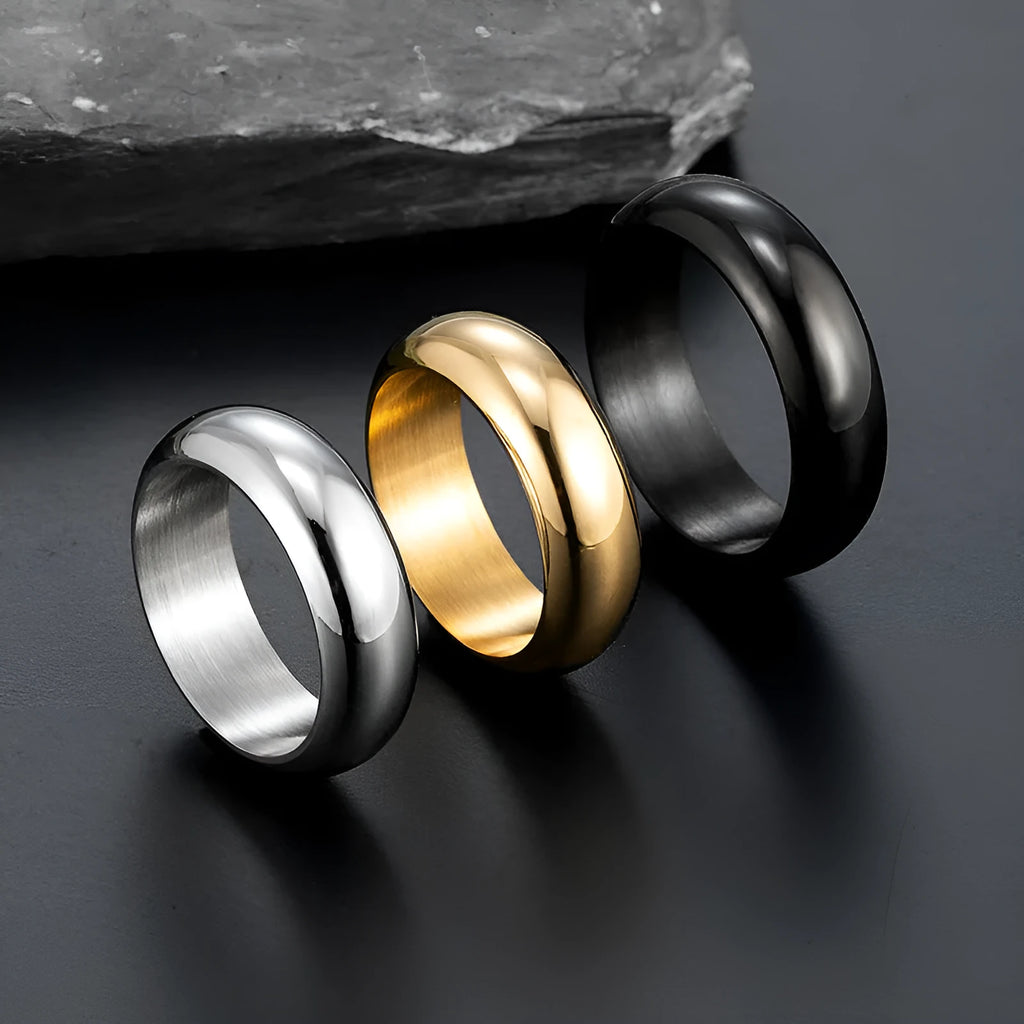 Glossy electroplated titanium steel ring in gold, black and steel colours showing detailed finish