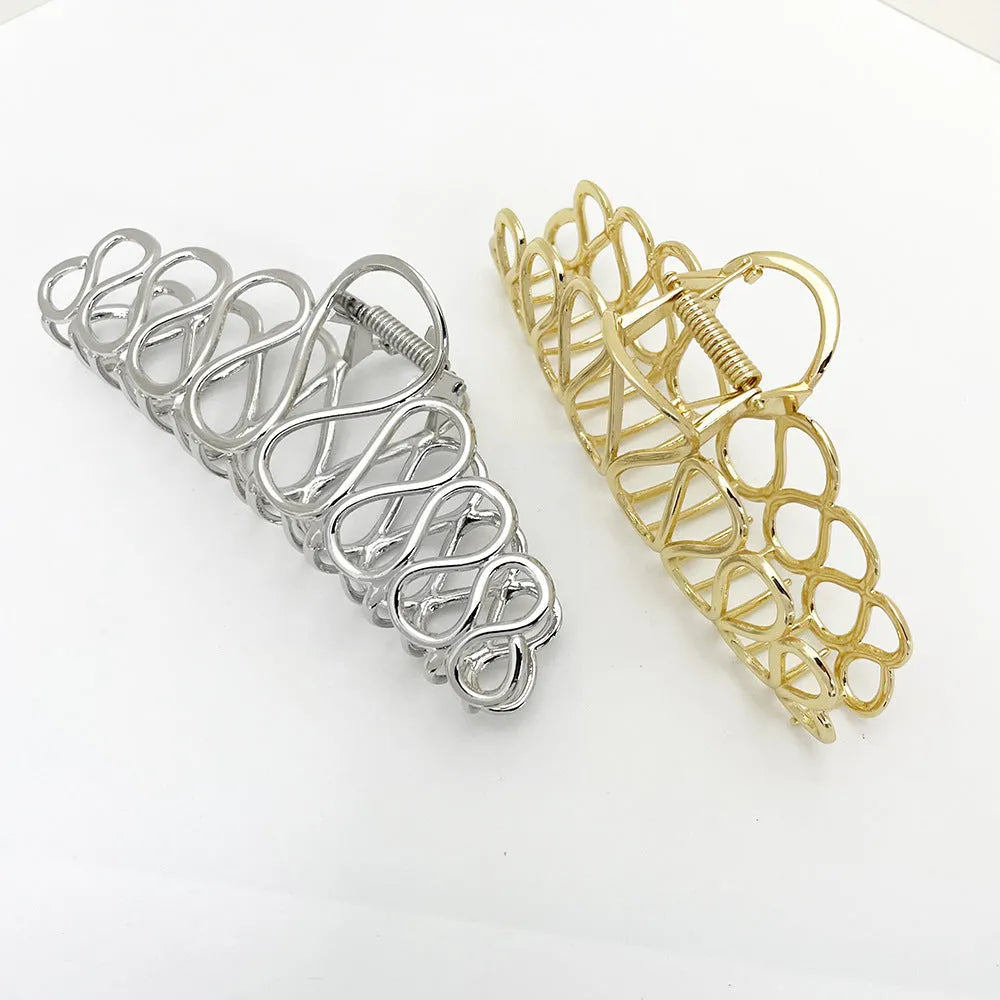 Women's minimalist hair clip in gold or silver with geometric tassel decoration