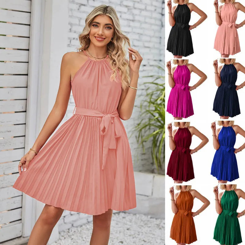 Women's black chiffon halter neck sundress with a pleated skirt and tie belt.