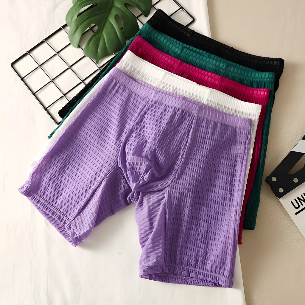 Men's solid colour lace boxer shorts with a lengthened hip-lifting design for shaping.