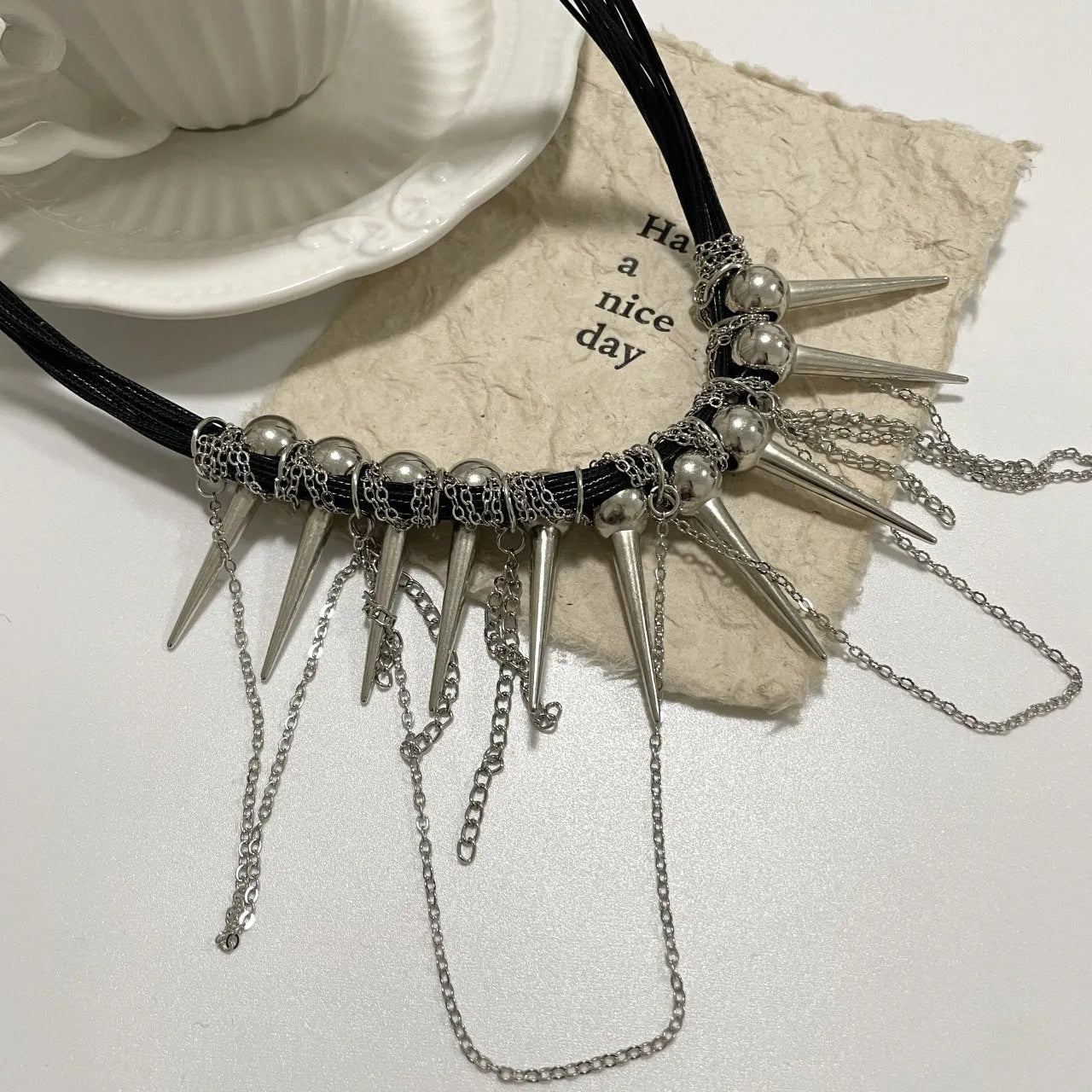 Round rivet bead winding tassel leather necklace in picture colour with electroplated finish.