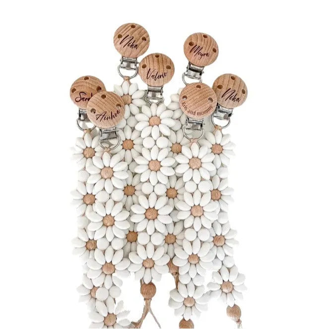 Silicone flower-shaped pacifier clip in Baby Pink with small beads and metal clip mechanism