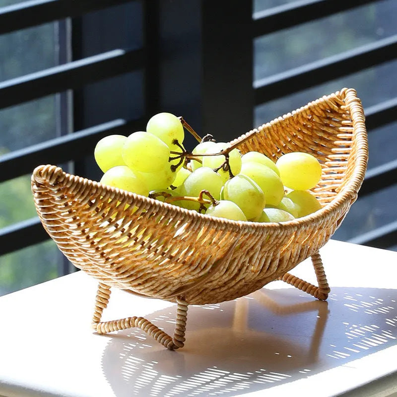 Plastic knitted basket fruit plate with dim sum snacks and melon seeds on a desktop