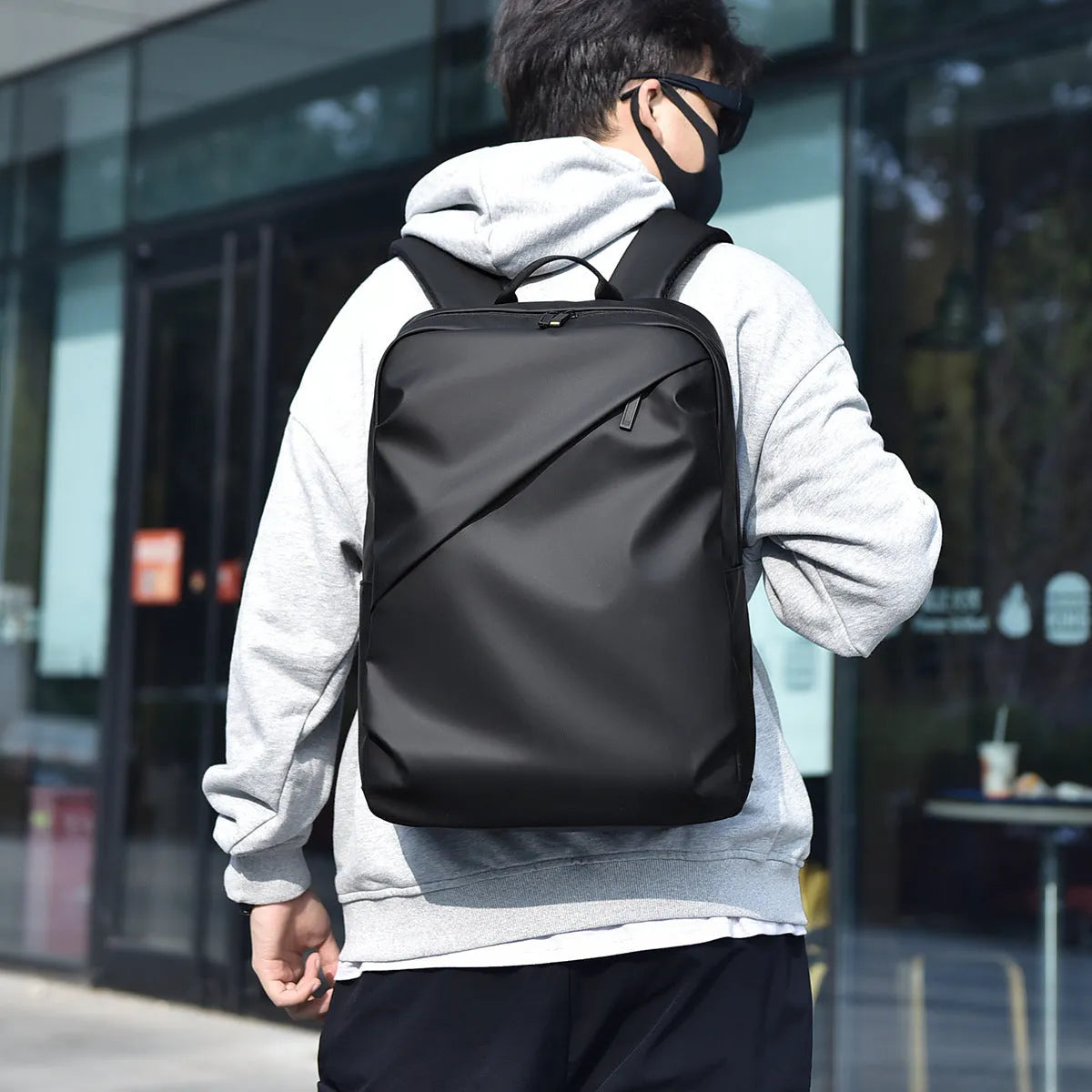 Black waterproof PU leather backpack for men with large capacity and computer compartment
