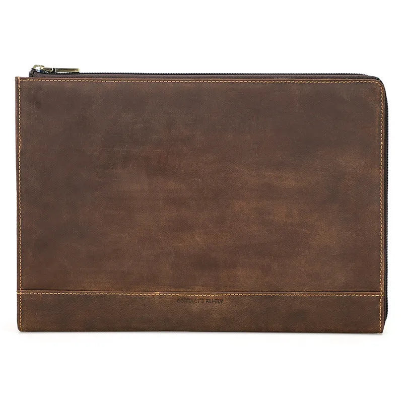 Crazy Horse oil leather zipper laptop bag in coffee colour on a wooden surface