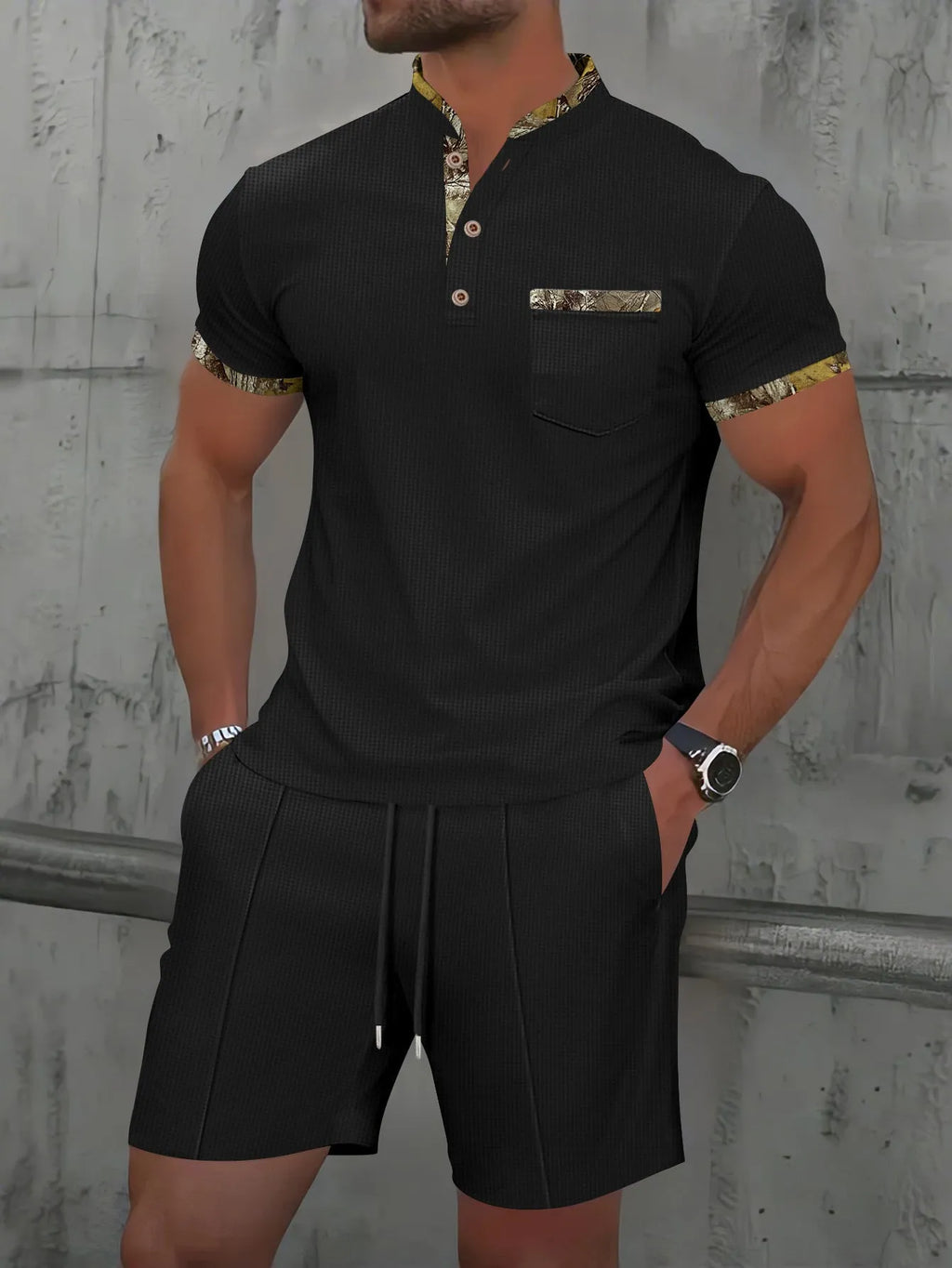 Men's grey short sleeve zip-up polo collar top and matching shorts laid flat.