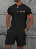 Men's grey short sleeve zip-up polo collar top and matching shorts laid flat.