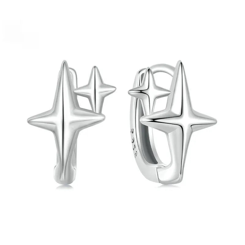 Sterling silver minimalist star ear clips with oxidised finish and clip-on fastening
