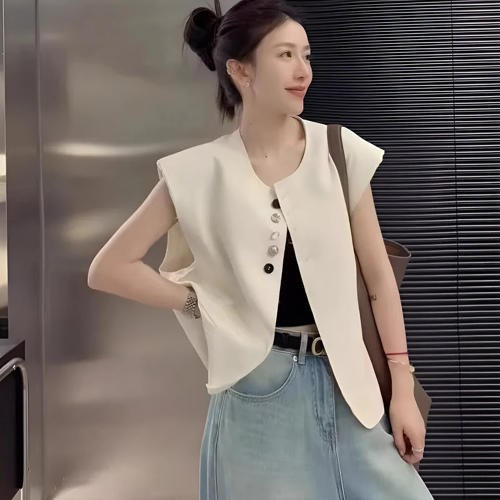 Women's loose fit polyester vest in milky white colour with pockets, shown on hanger