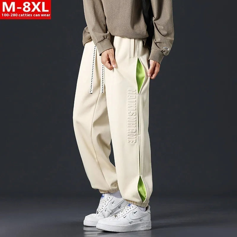 Men's loose fit cotton trousers with banded ankle and collage stitching detail in grey green