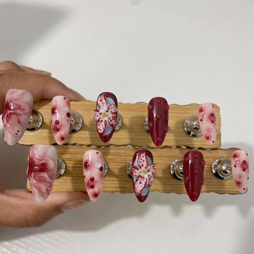 Hand-painted three-dimensional carved artificial nails in almond shape with floral and geometric patterns