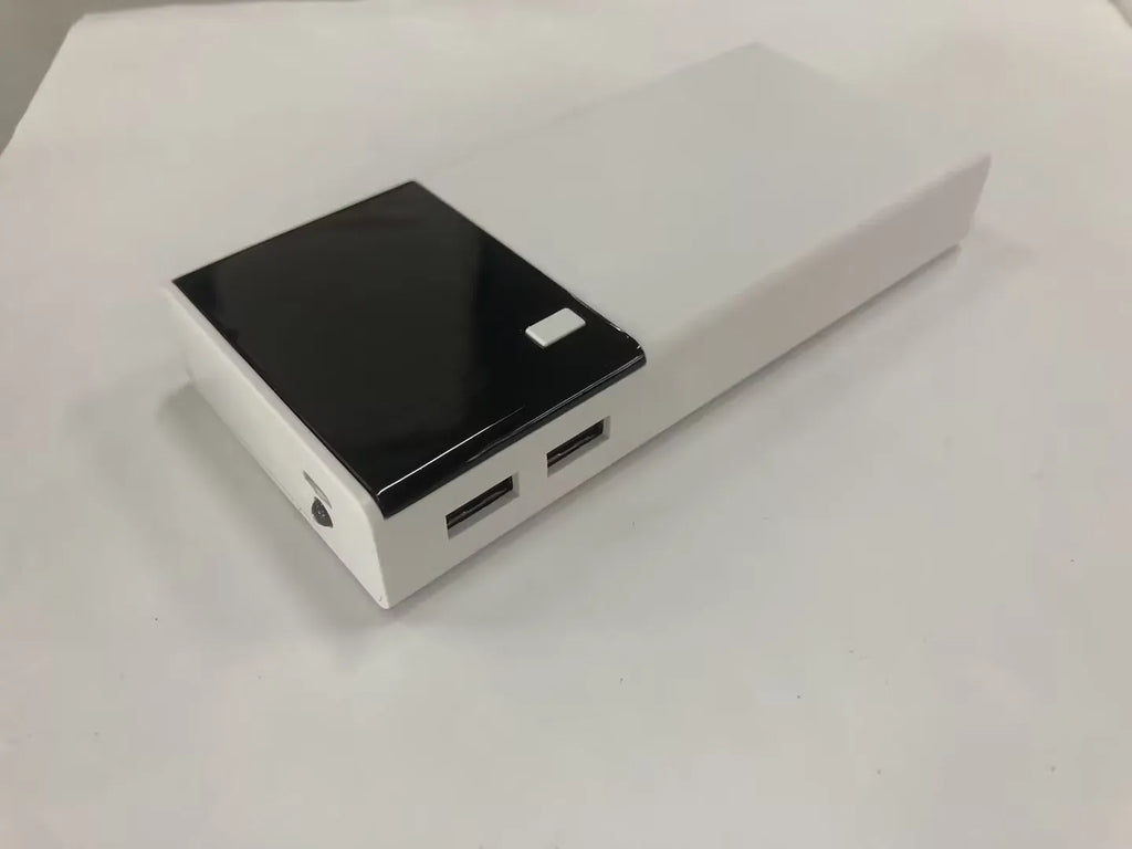 Black 20000mAh portable power bank with included USB charging cable