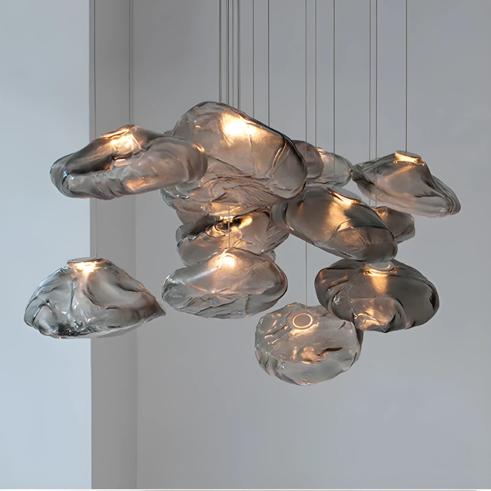 Modern minimalist glass chandelier with LED lighting in amber, clear, or smoke grey colour options