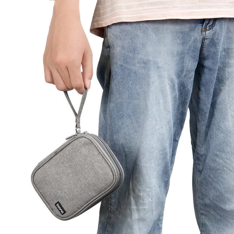 Black and grey Oxford cloth protective covers for a 2.5-inch portable hard drive.