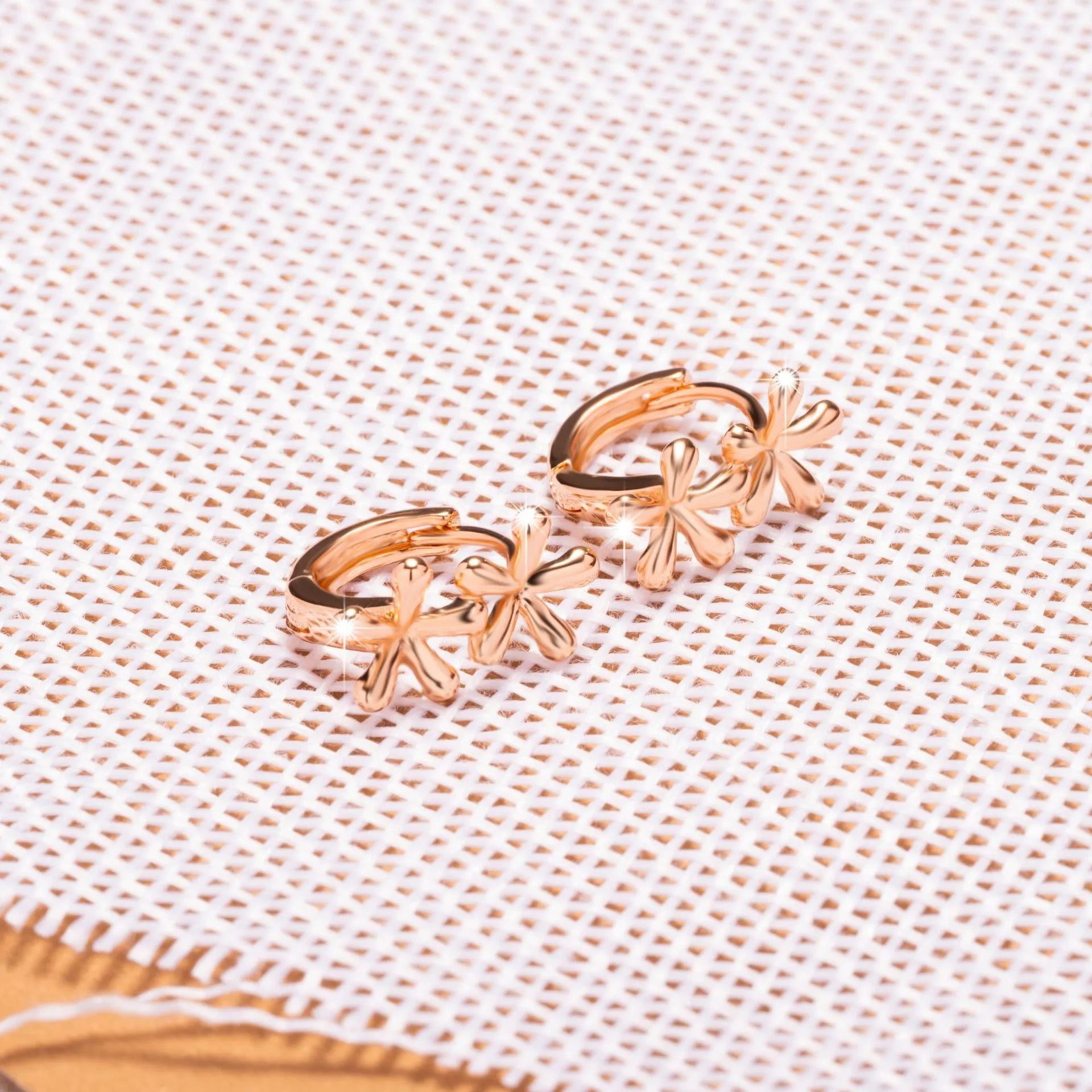Circular rose gold electroplated earrings with waterdrop flower pattern for women