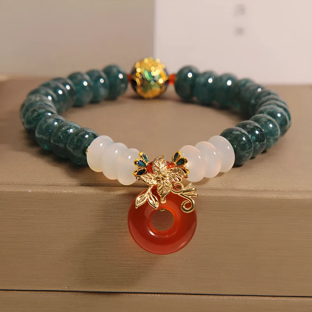 Blue water jade and red agate bracelet with crystal beads and a peace buckle closure