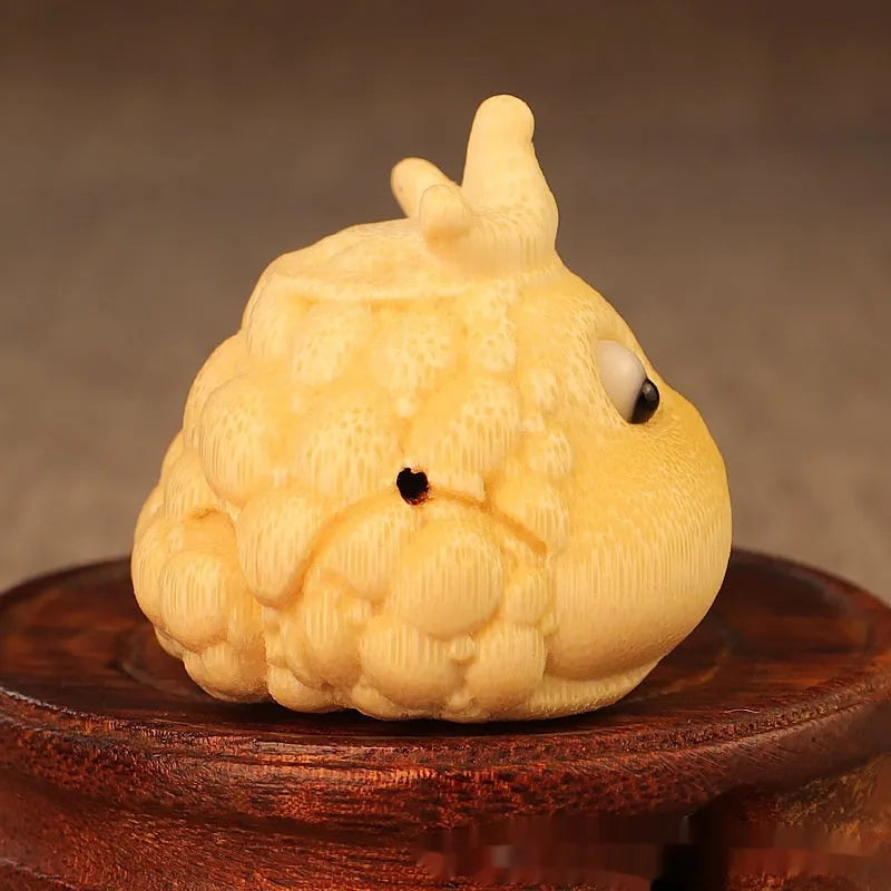 Solid bamboo carving of a cute Crown Princess Toad ornament with detailed live eyes.