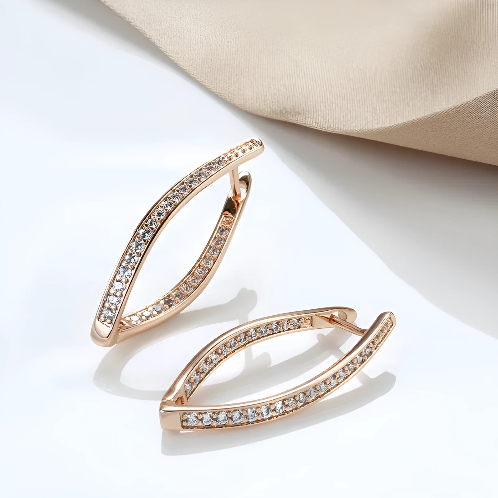A pair of geometric drop earrings for women made from copper with zircon accents in H0493 colour.