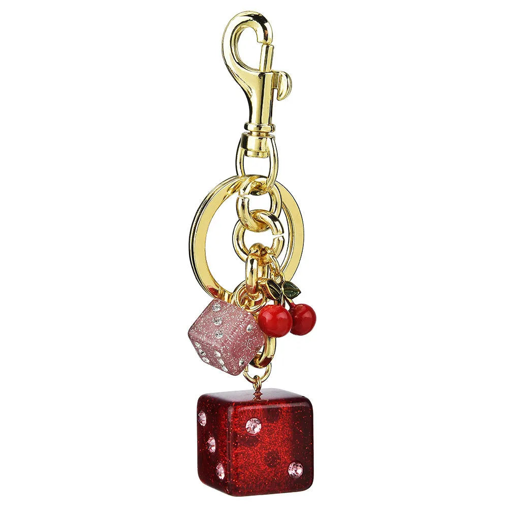 Square metal keychain pendant with cherry two-tone dice pattern and electroplated finish
