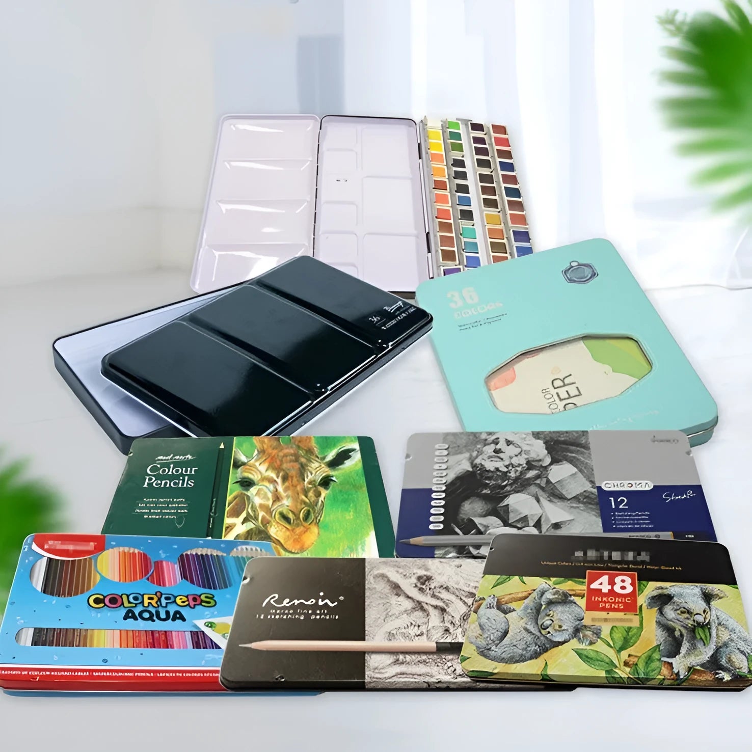 Solid tinplate folding paint box for watercolour paints shown in square shape.