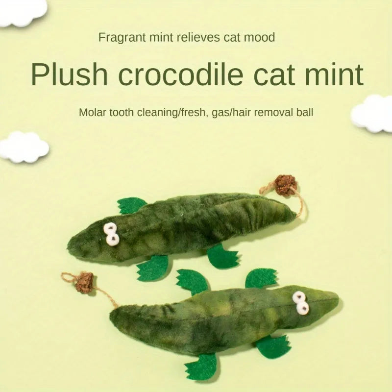 Green plush alligator cat toy with a textured reptilian design on a white background.