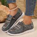 Women's low-top flat slip-on shoes in black with a round toe and rubber sole.