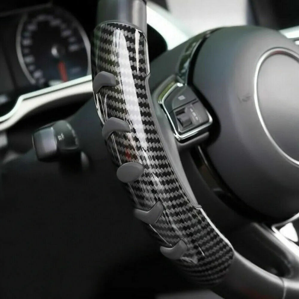 Carbon fibre black steering wheel anti-slip sleeve showing textured surface and 38cm diameter measurement