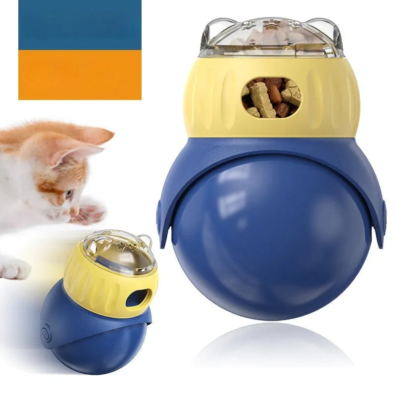 Yellow and blue plastic tumbler-style cat feeder puzzle toy on a floor.
