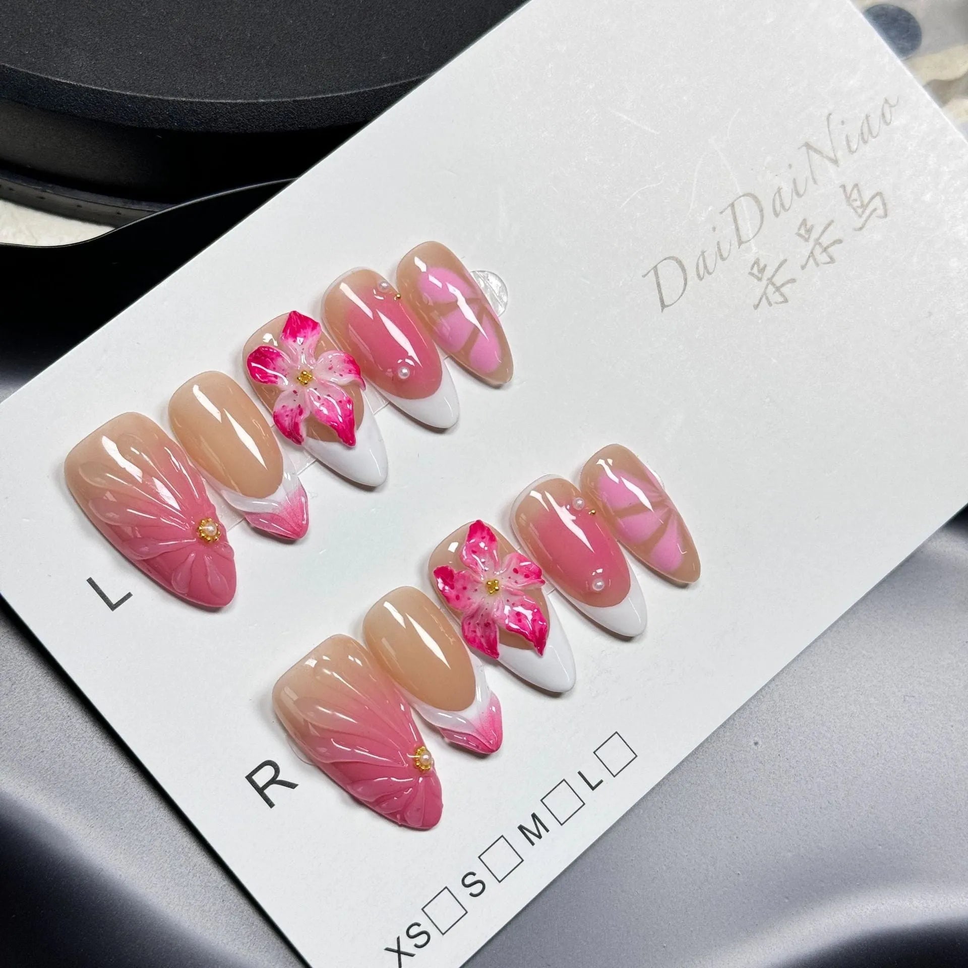 French style 3D lily ice flower design on almond-shaped plastic false nails.