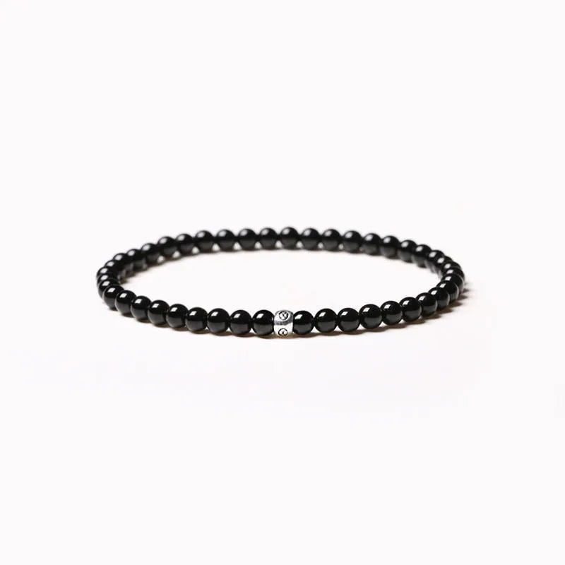 Geometric agate bracelet with mixed stone beads in black, blue, and obsidian colours