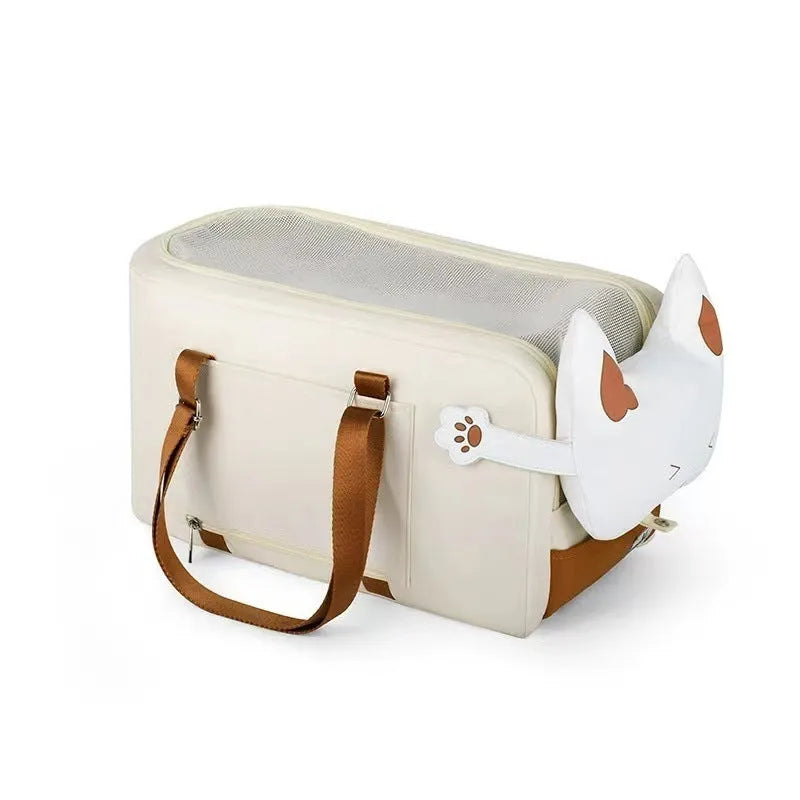 Hard-sided beige pet carrier with shoulder strap for cats and small dogs