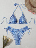 Women's denim blue strappy bikini set with printed design and two-piece swimwear construction