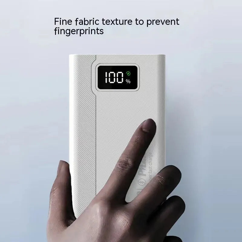 Black and white large capacity power bank with fast charging support measuring 150mm x 76mm