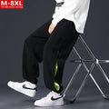 Men's loose fit cotton trousers with banded ankle and collage stitching detail in grey green