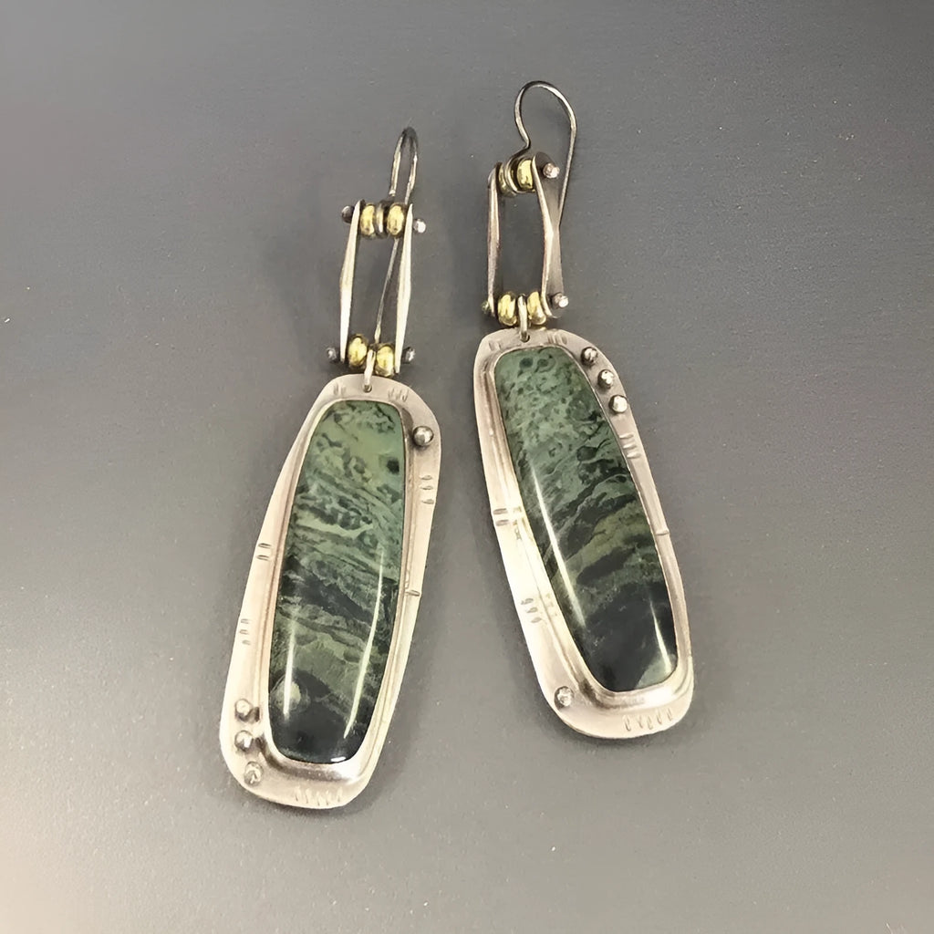 Two-colour marble pattern geometric alloy earrings showing geometric shape and two-tone surface design
