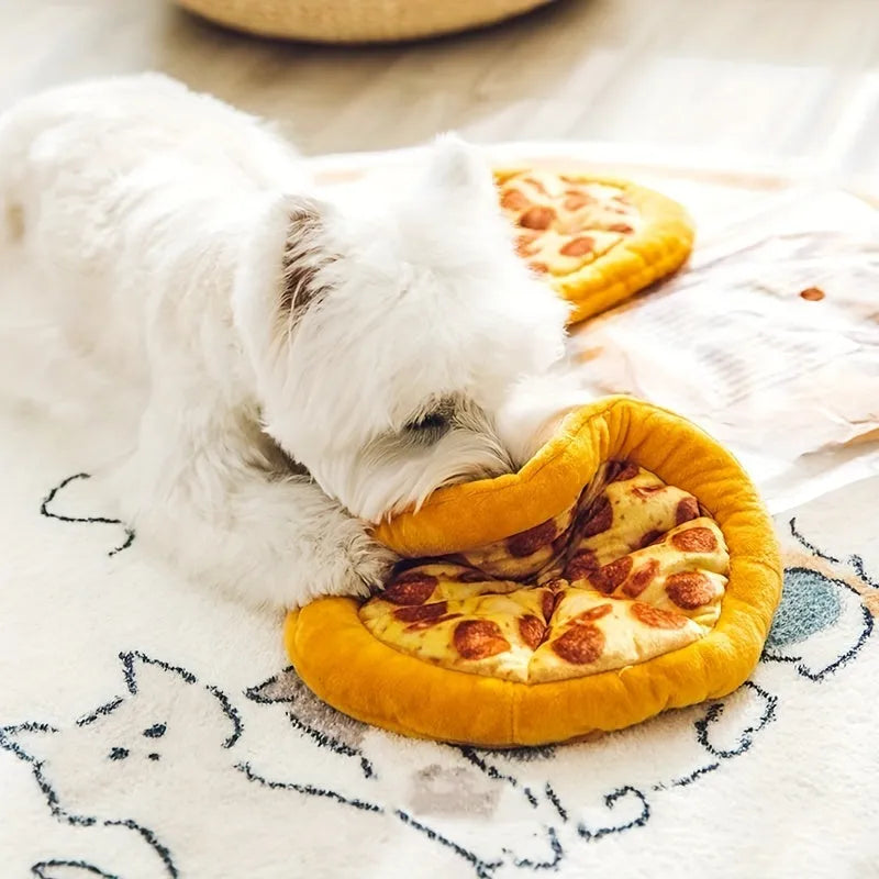 Yellow pizza slice shaped plush squeaky dog chew toy on a white background