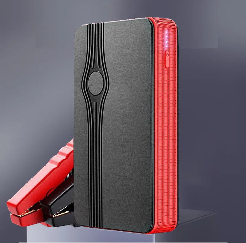 Red K4-E automobile emergency starting power supply and jump starter unit with data cable.
