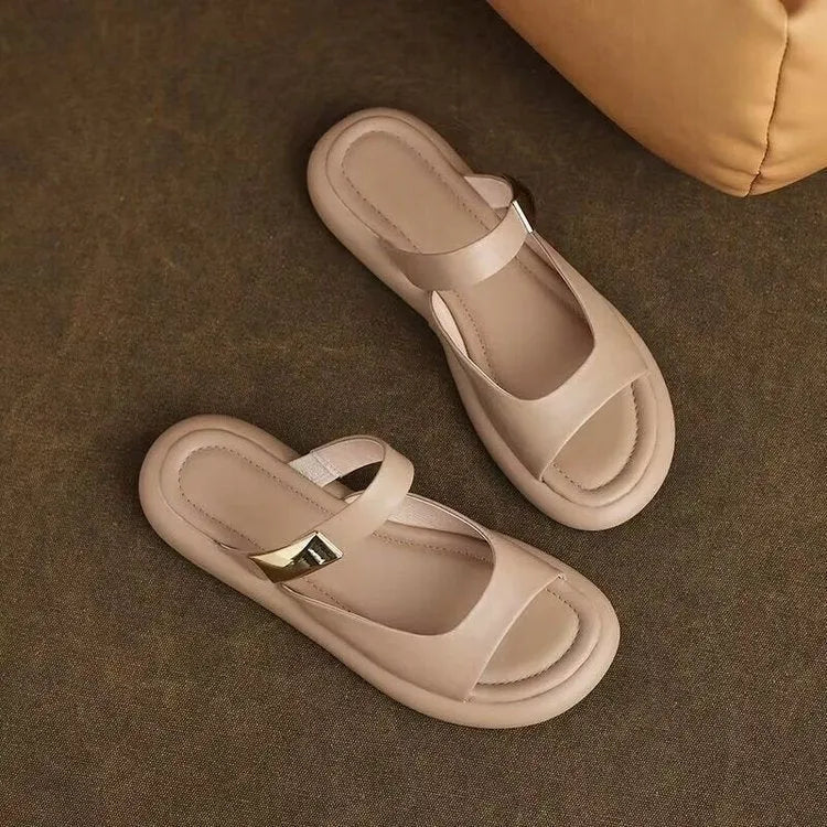 Women's apricot and white soft leather peep toe flat platform sandals with a rubber sole.