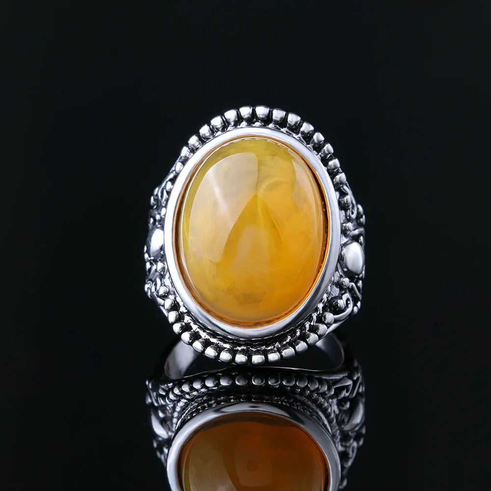Retro geometric alloy ring with fluorescent beeswax plating in antique silver amber colour.