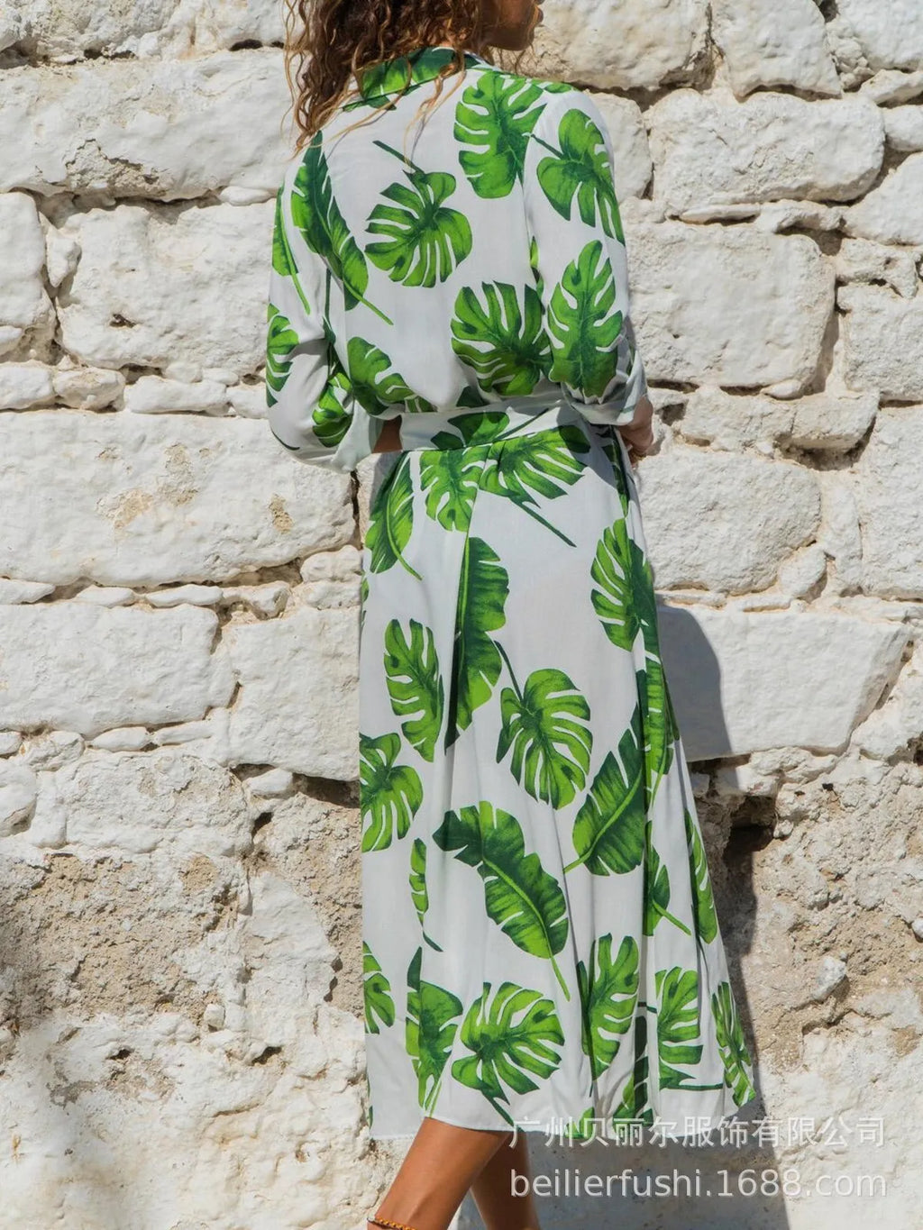 Women's printed chiffon maxi dress with V-neck and A-line skirt on a hanger.