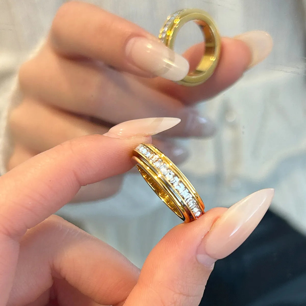 Titanium steel rotatable ring with starry sky design in gold electroplate finish on a dark background