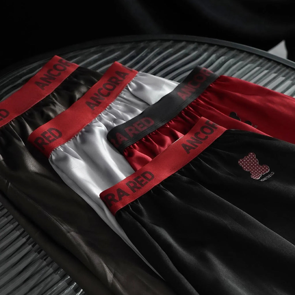 Solid colour men's boxer briefs in polyester fabric showing mid waist design and colour options