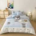 Cartoon Schnauzer embroidered bedding set with flat sheet and matching pillow on bed