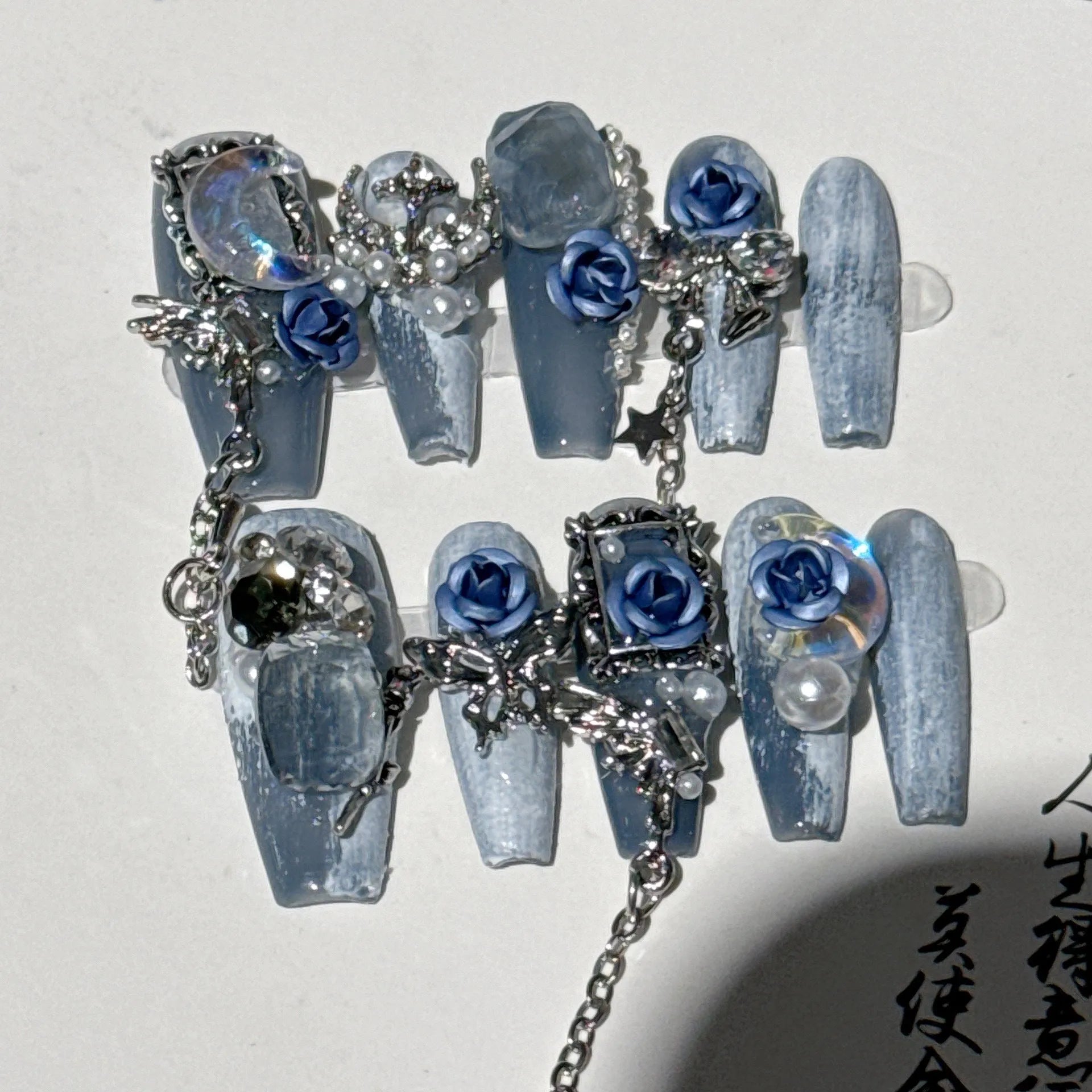 Heavy industry night blue nail stickers with ornate rose and tulip flower pattern for evening manicures.
