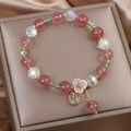 Red double-layer crystal bracelet with Lucky Cat charm and floral beads on wrist