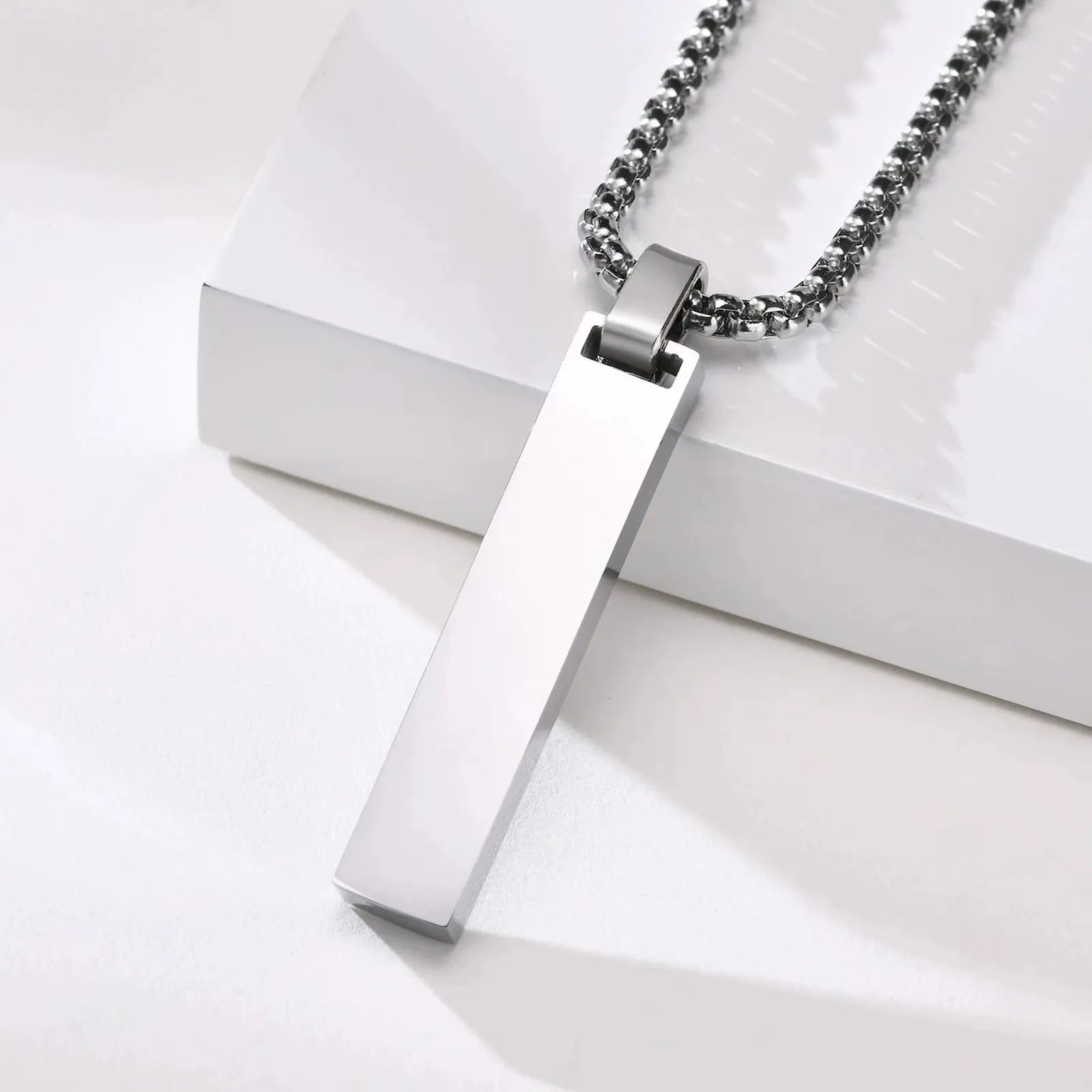 Stainless steel roman numeral pendant necklace available in black, gold, and steel colour options