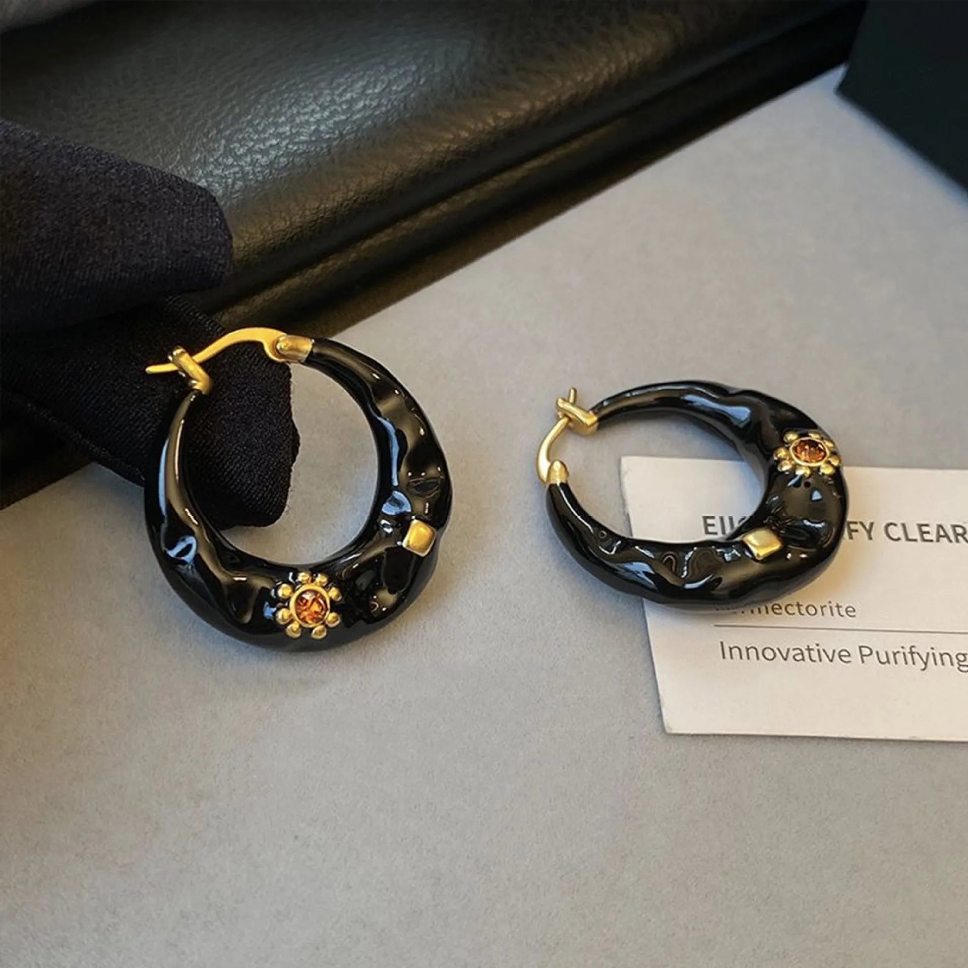 Retro Hong Kong style ear studs with rhinestone inlay and dripping oil textured finish in black and red colours