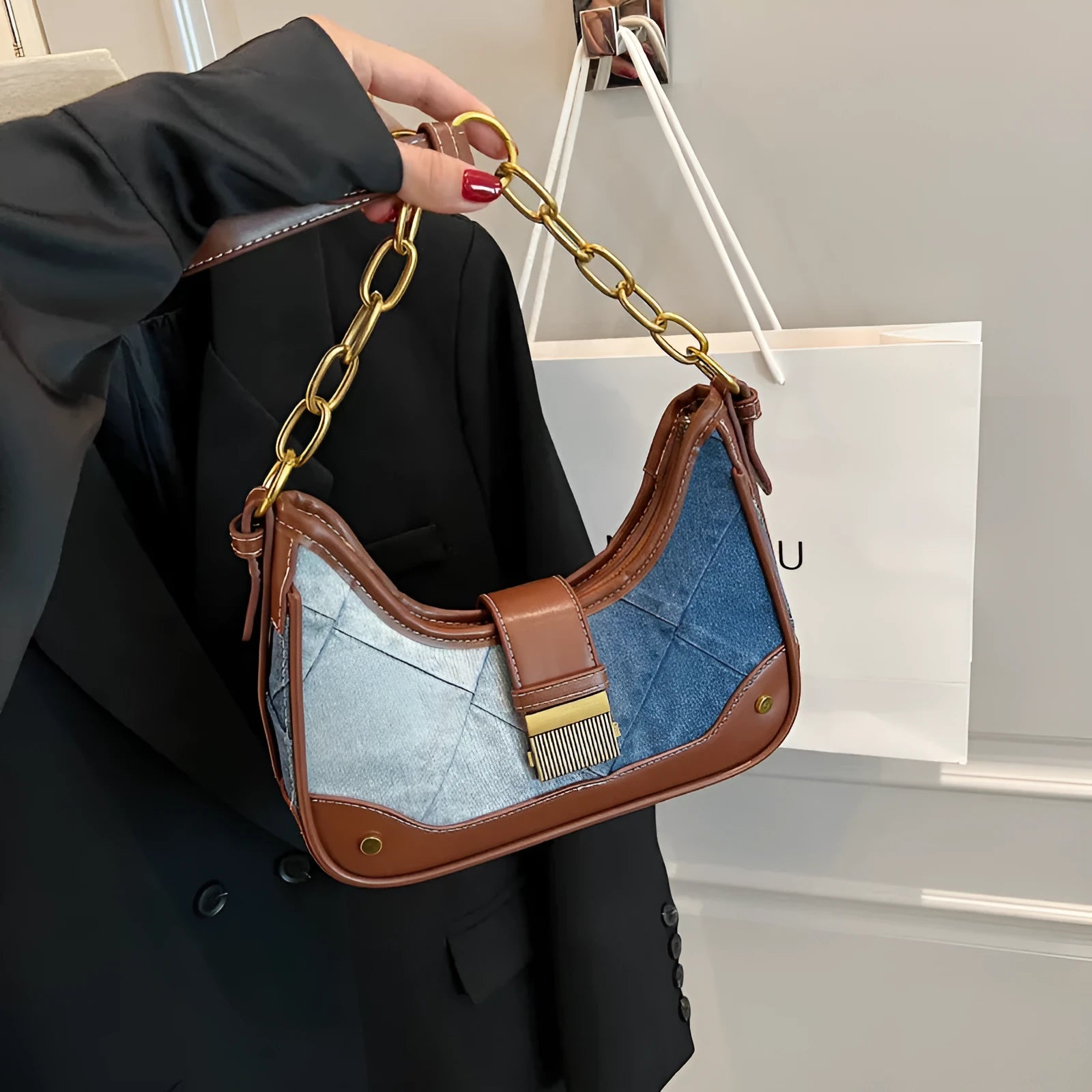 Brown denim women's bucket shoulder bag with diamond chain detailing and double straps