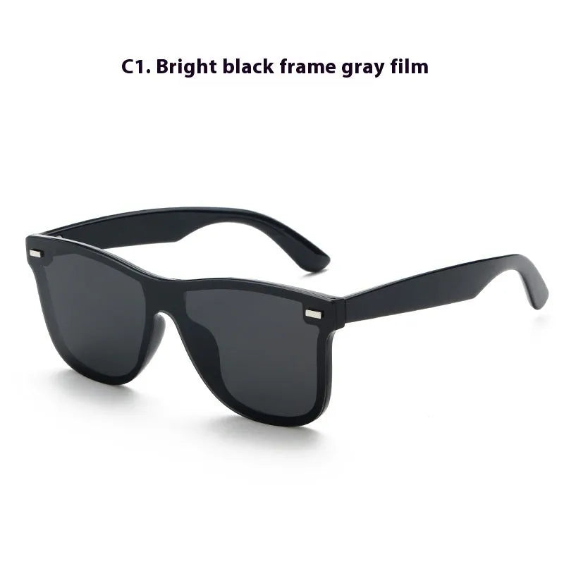 Polarised sunglasses in sand black frame with grey lenses, suitable for outdoor sports and fashion.